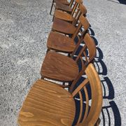 7 curved wooden bistro chairs by Baumann
