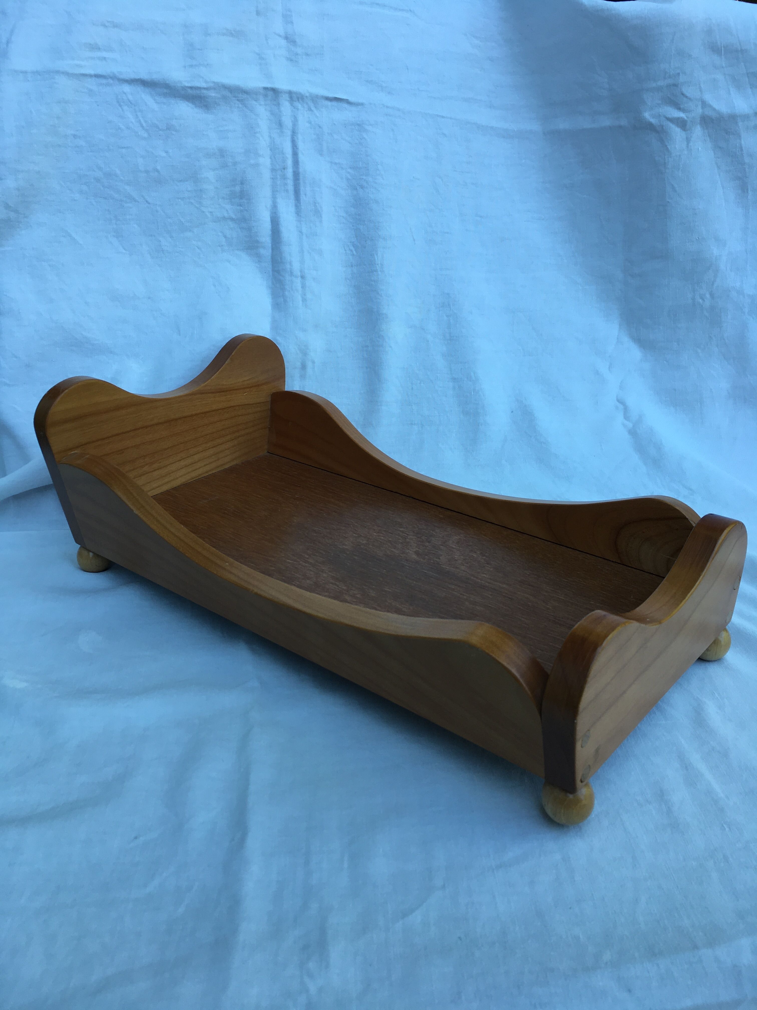 Wooden doll bed
