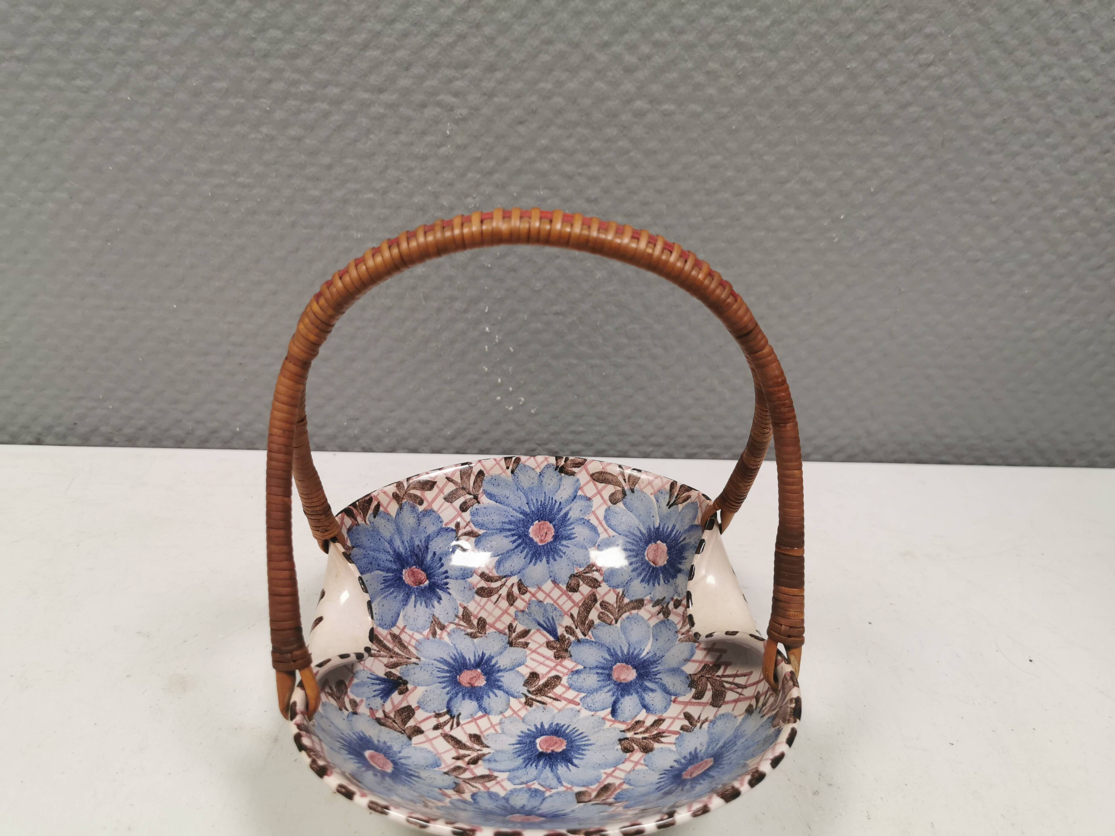 Beautiful small painted ceramic basket with woven handle