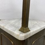 Brass bedside table with a marble top.