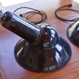 Pair of black enamelled sheet metal pendant lights from the 1950s.