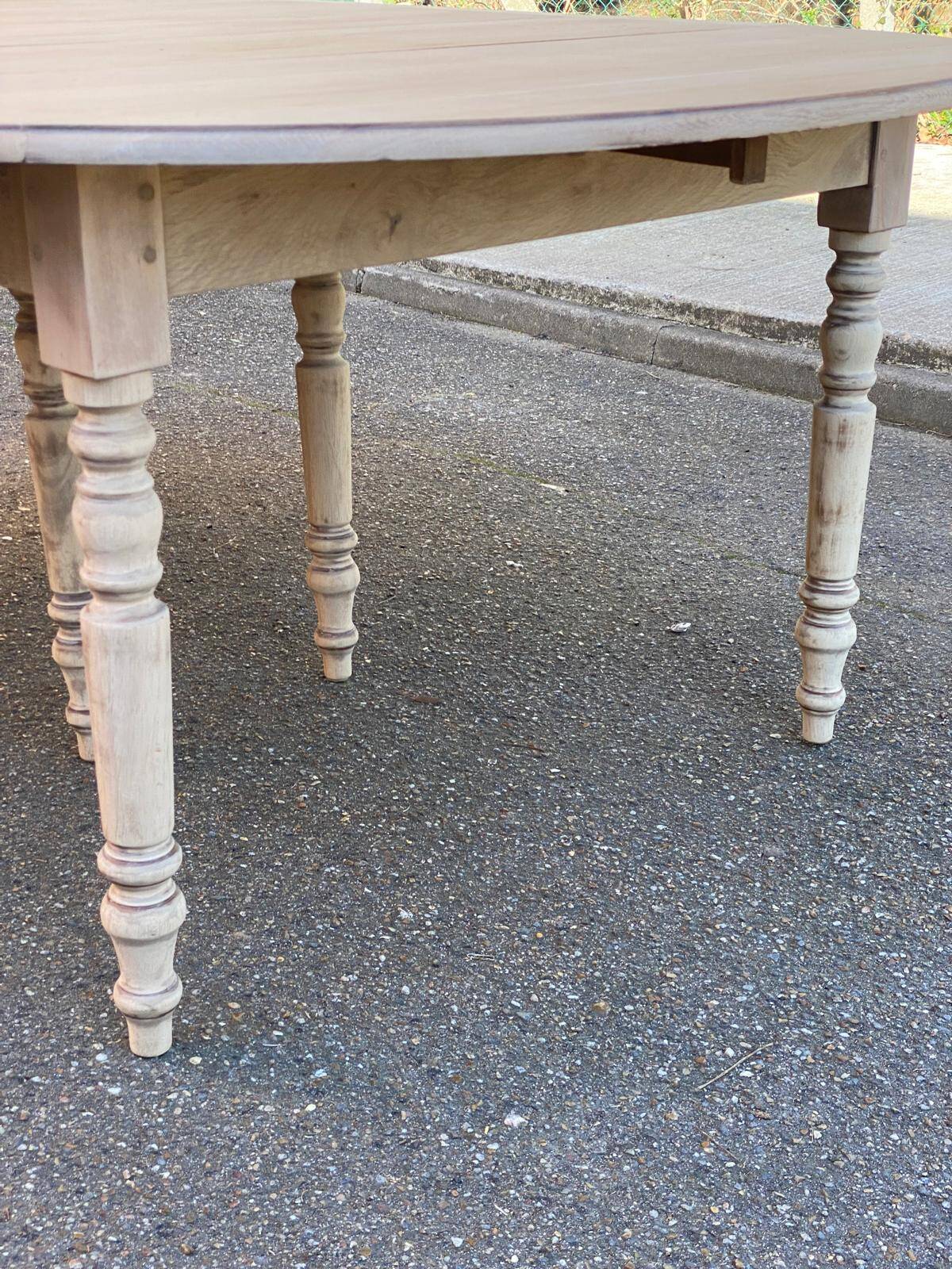 Louis Philippe round extendable dining table with renovated leaves and 4 extensions.