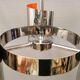 Hanging lamp in chromed metal with orange contrast lacquer and three light sources.