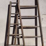 Two weathered wooden ladders H.135 cm