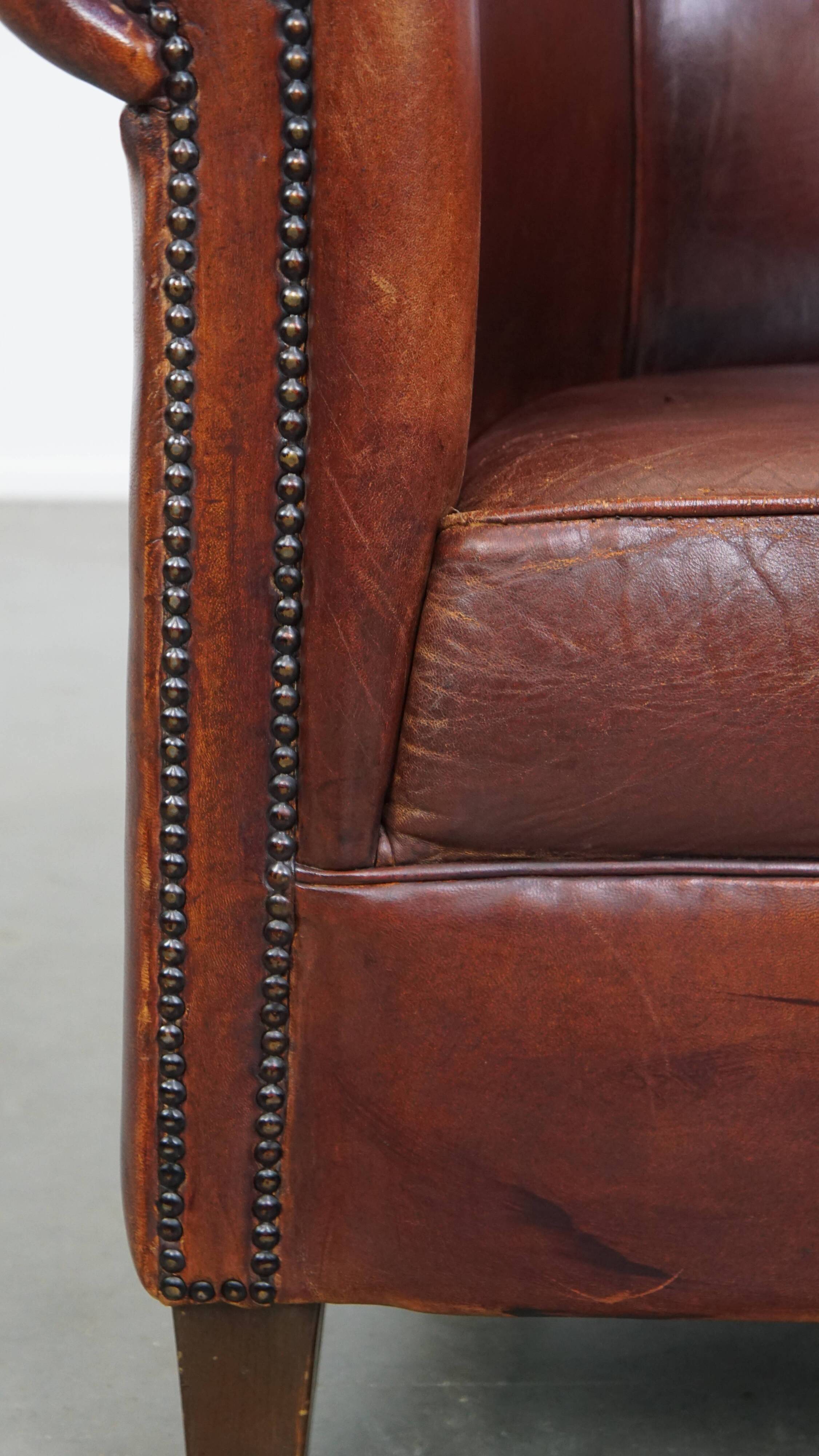 English style sheepskin club chair with a beautiful patina