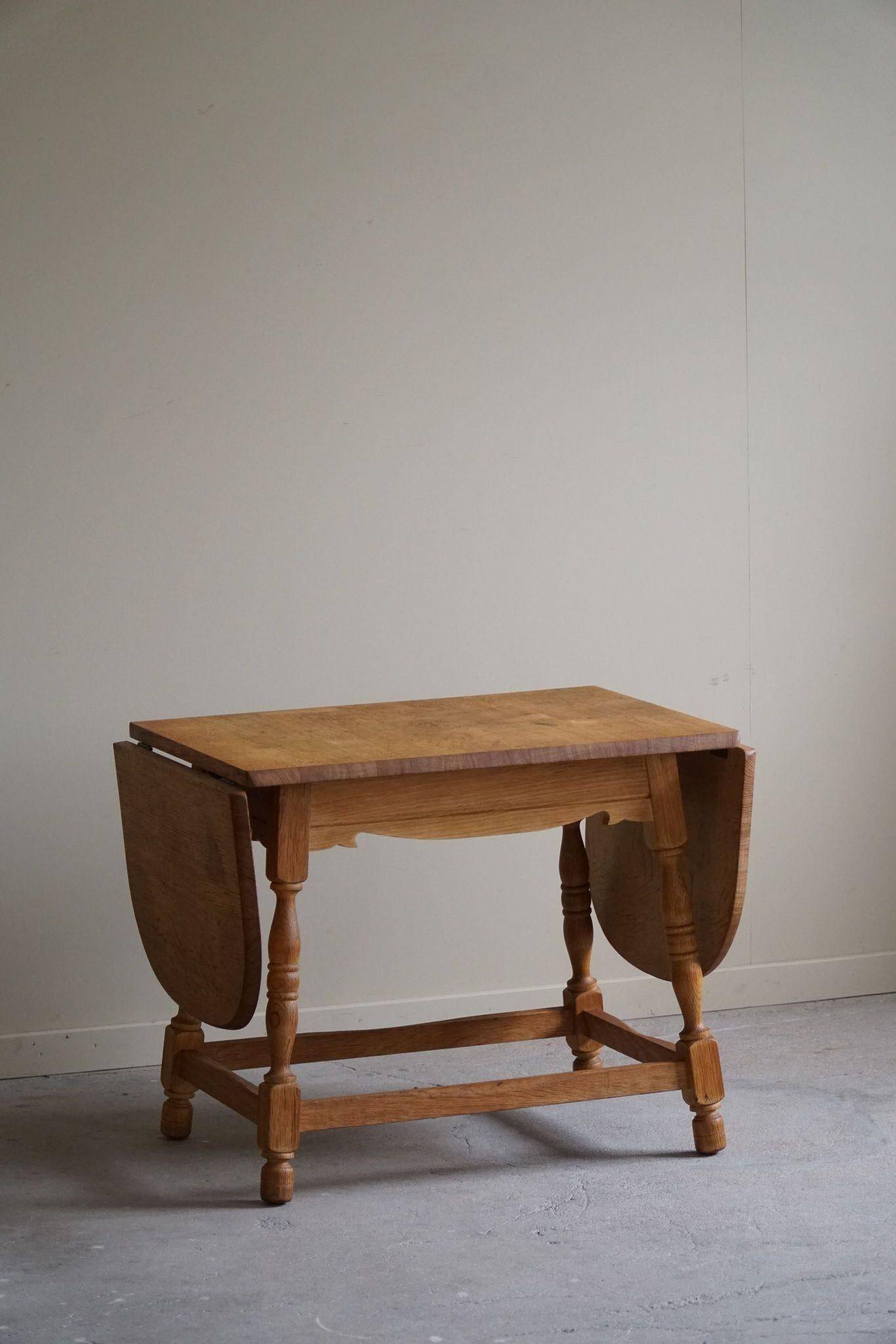 Danish mid-century folding side table in oak, Henning Kjærnulf, 1960s.
