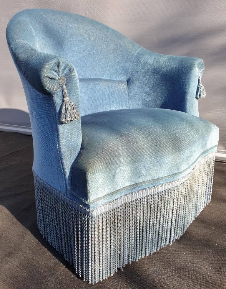 Blue velvet toad chair with fringes and pom poms