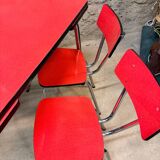 4 red Formica chairs with a 1970s table