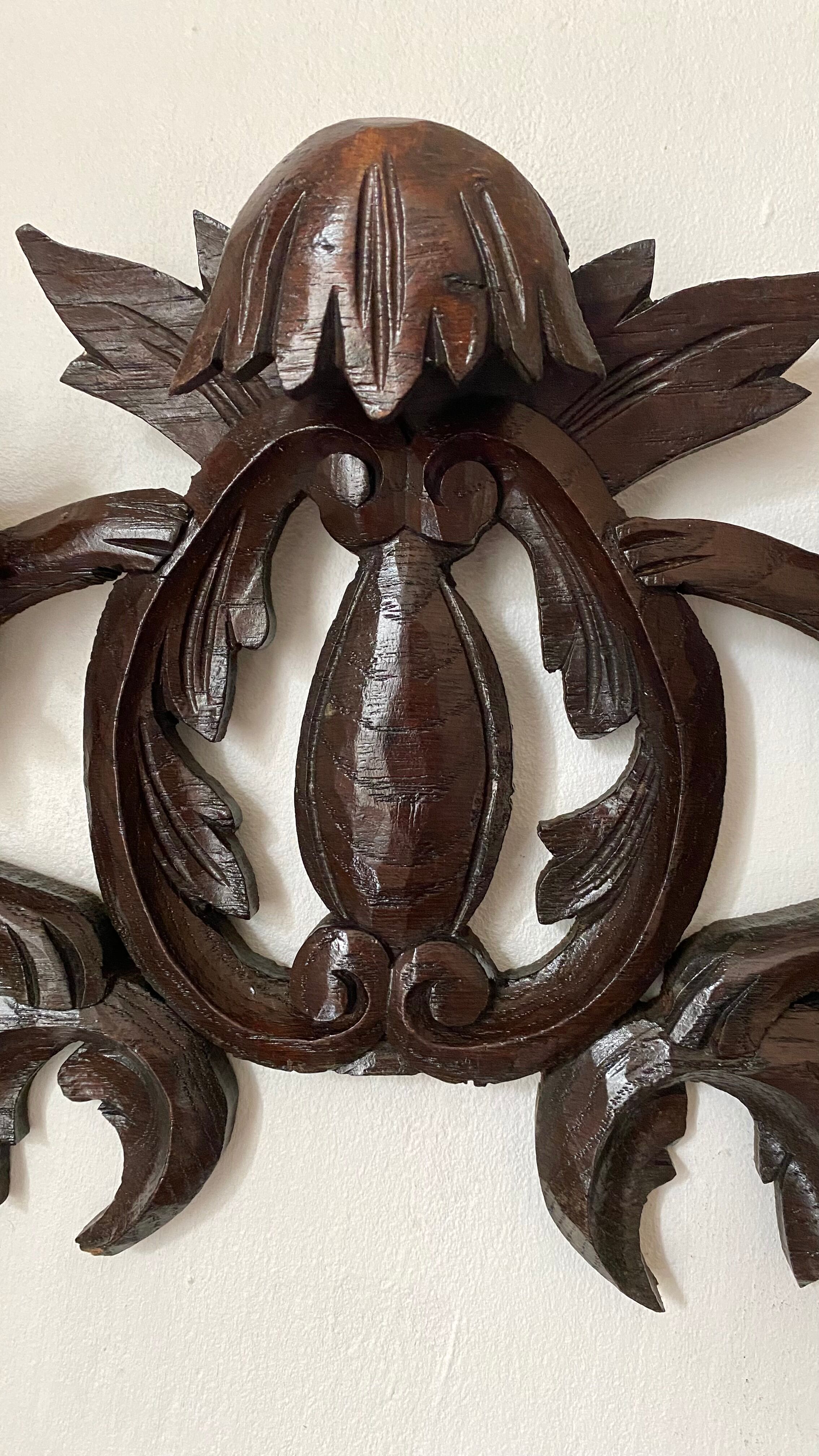 Antique carved wooden pediment with lions and medallion