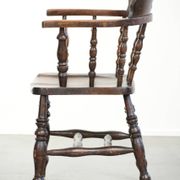 Wooden English antique pub/captain chair from the late 19th century