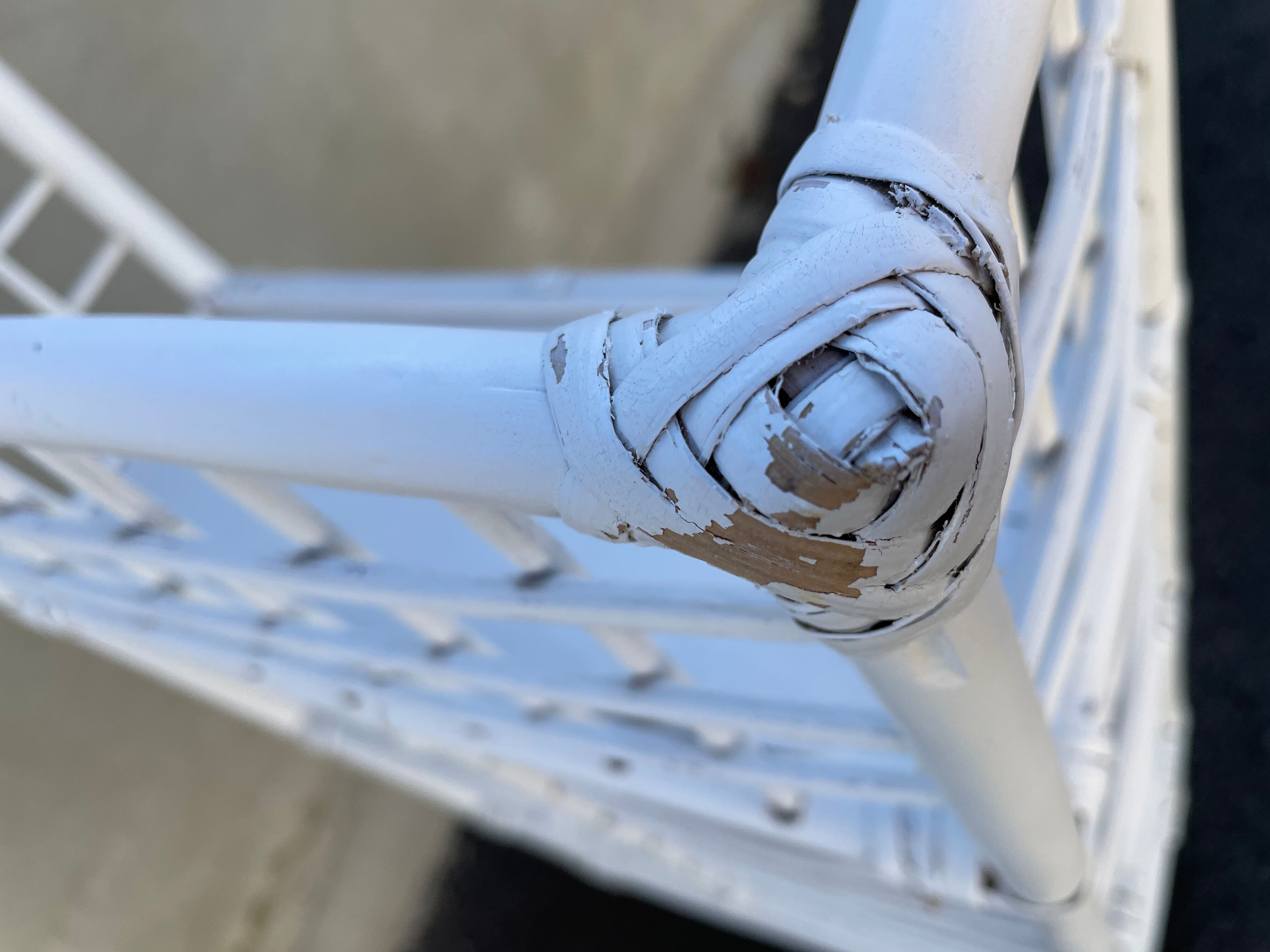 White rattan shelf with braces