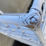 White rattan shelf with braces