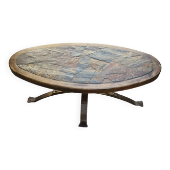 Oval wooden coffee table with vintage hammered iron base