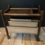 Vintage rattan magazine rack on wheels
