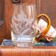 Half-pint mug engraved with floral motifs and with an amber glass handle