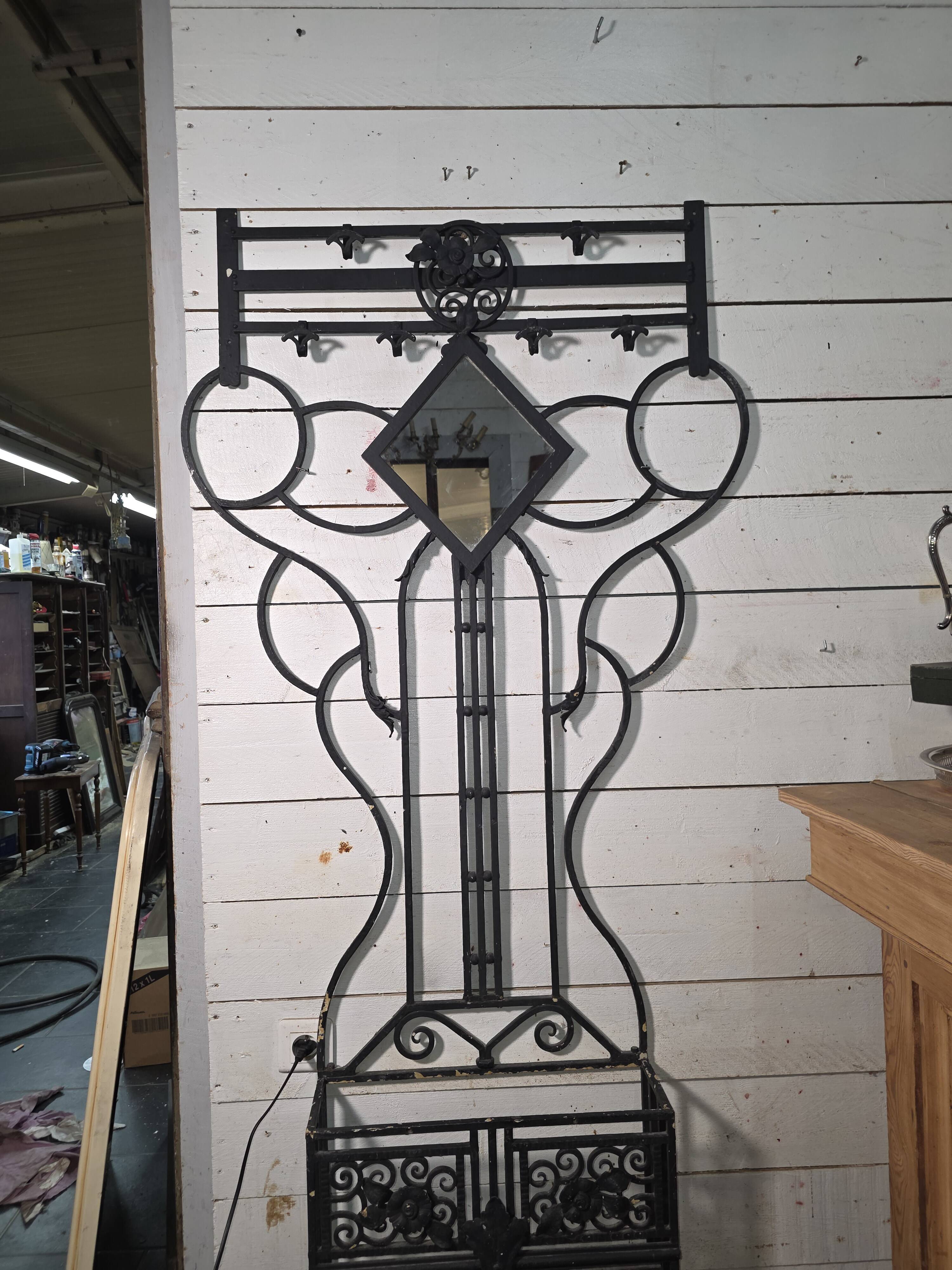 Art Deco coat rack wardrobe in wrought iron from the 1930s.