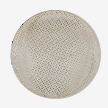 Round service tray in perforated metal by Mathieu Matégot