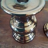 Two bronze-colored candlesticks
