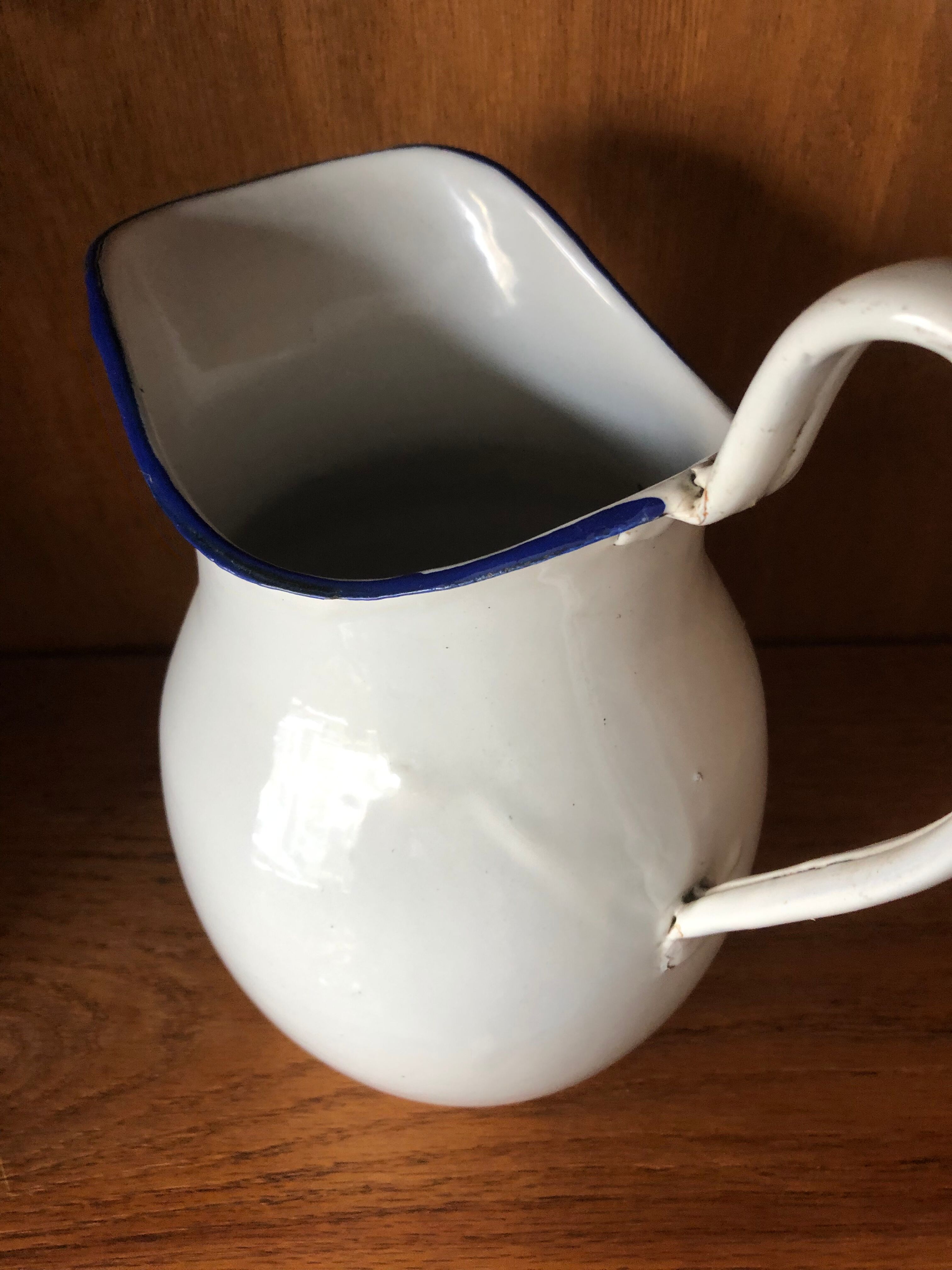 Enamelled plate pitcher