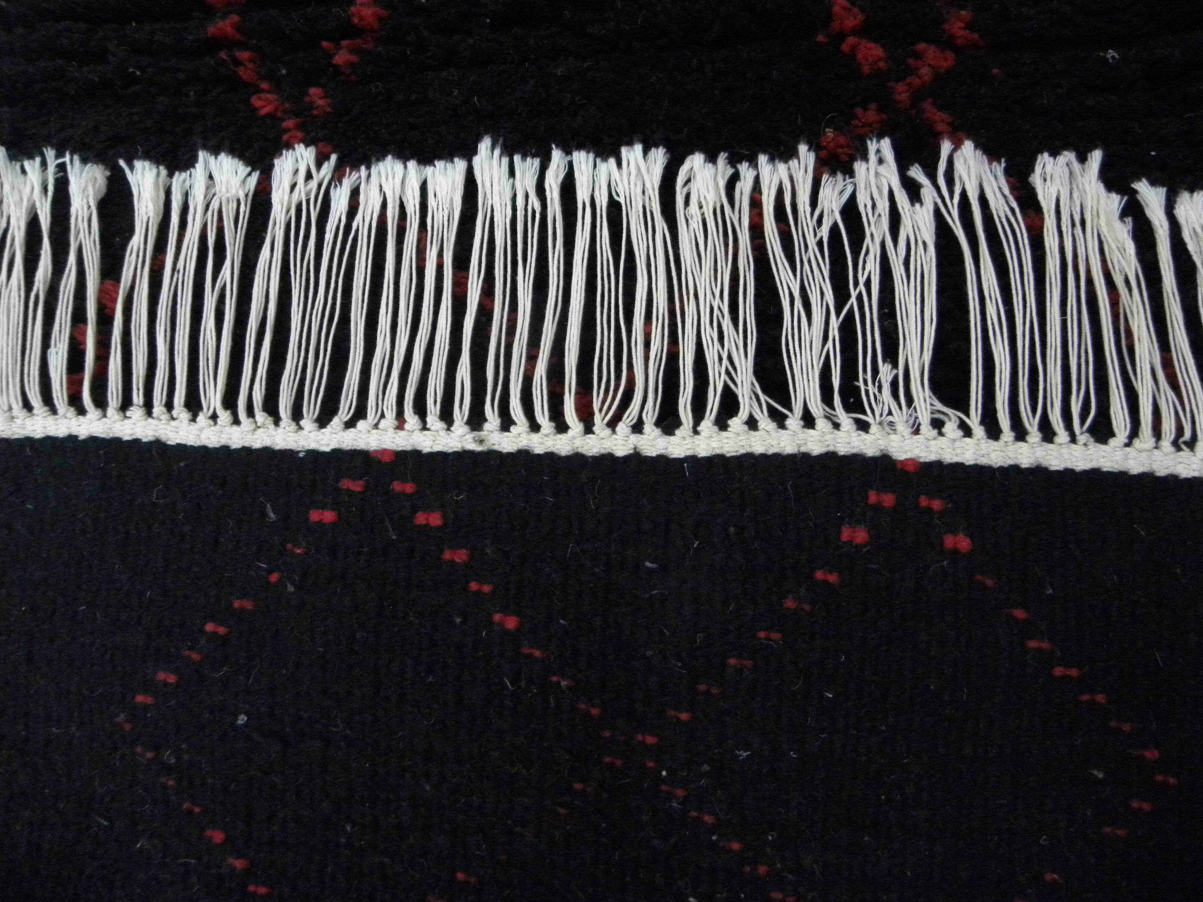 Vintage ancestral black Berber rug in wool