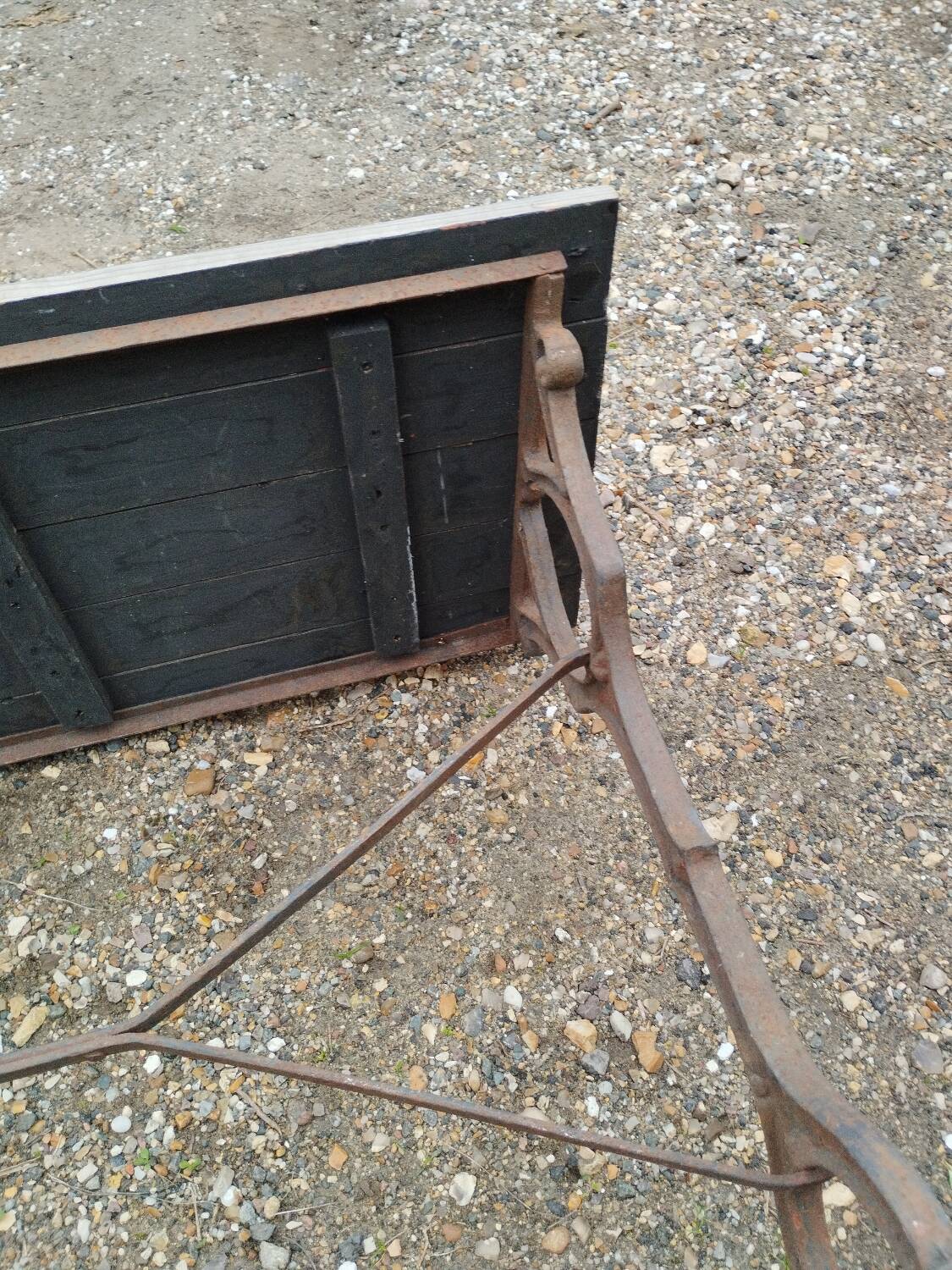 Antique bistro table with iron legs and wooden top