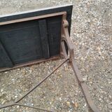 Antique bistro table with iron legs and wooden top