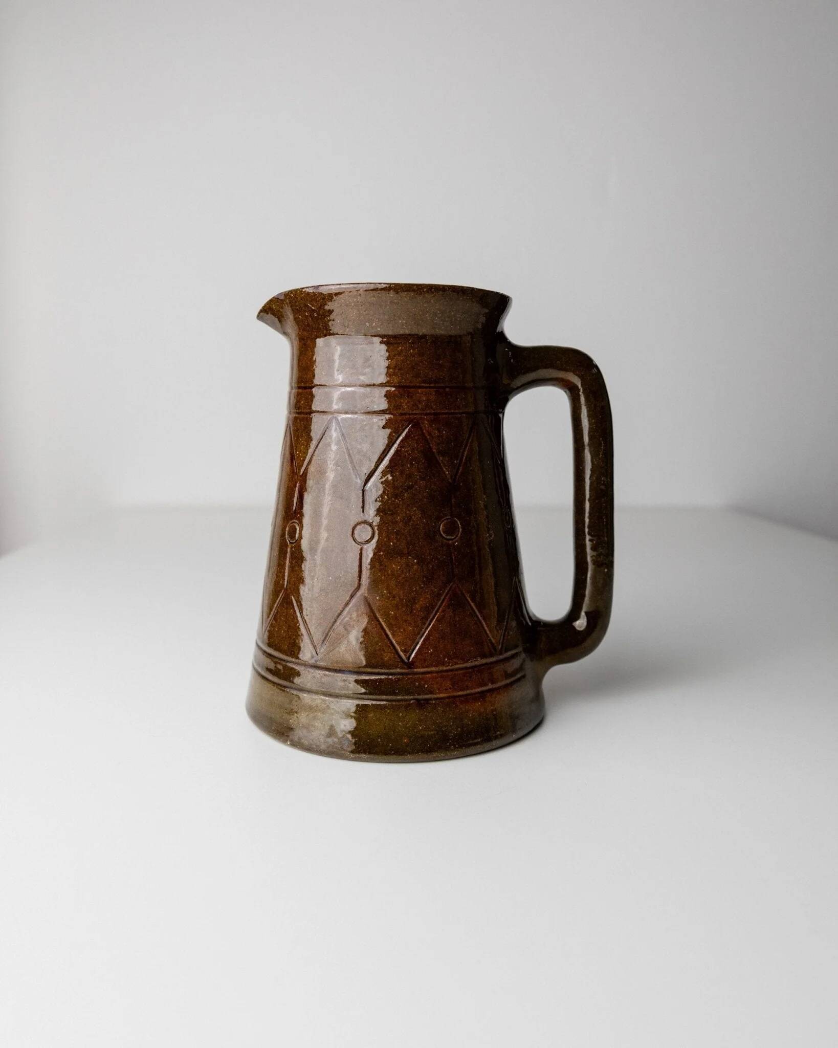 Vintage ceramic pitcher or vase with handle by Urbano Fontana, relief, brown glaze, Italy 1970s.