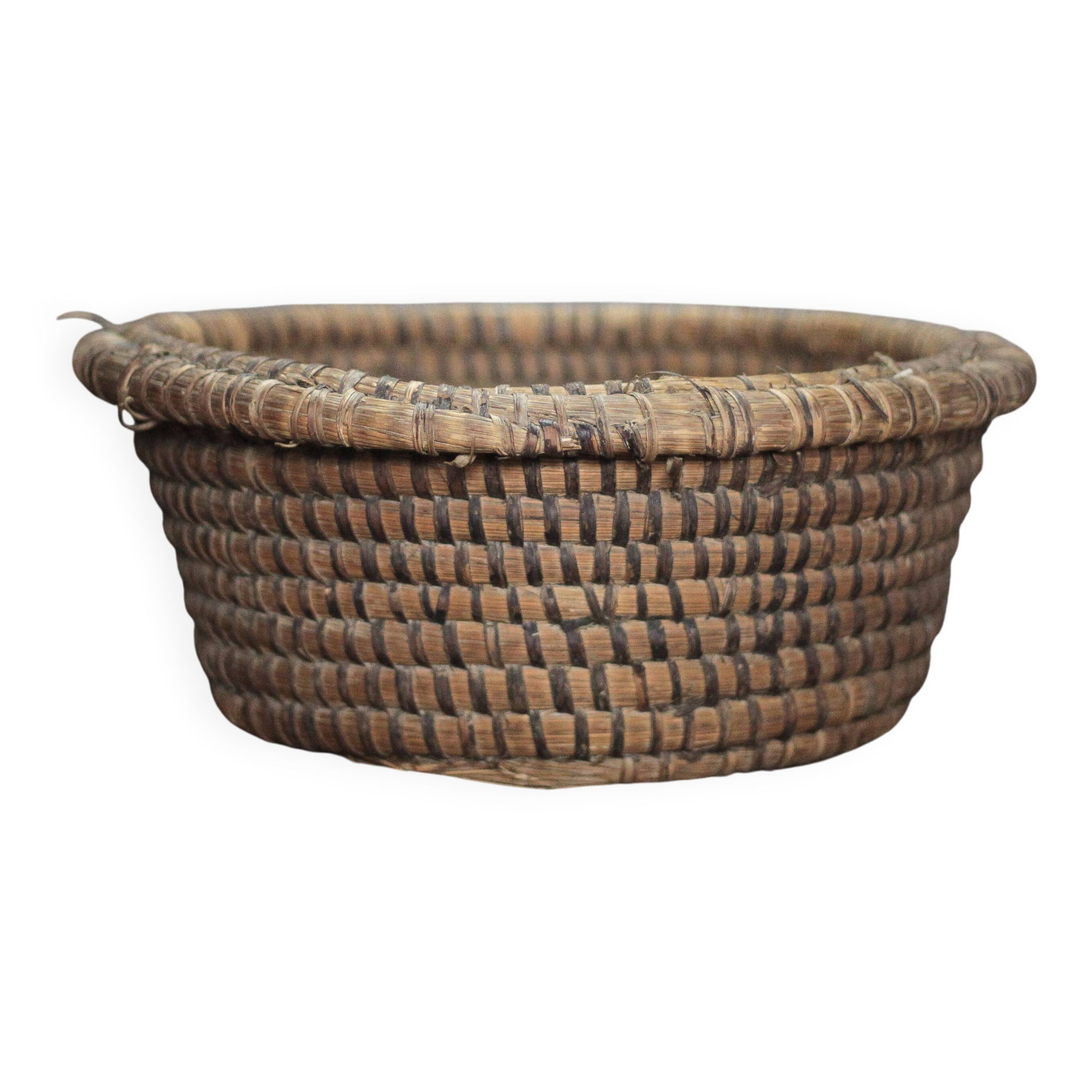 Old wicker basket, straw and bramble, woven basket, countryside.