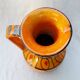 Orange ceramic jug
