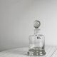 Glass carafe with spherical stopper