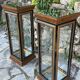 Pair of display cases in magnifying glass and black & gold lacquer, 20th century period