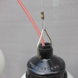 Trio of opal glass and bakelite globe pendant lights