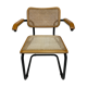 Cesca model chair designed by Marcel Breuer with black-framed armrests