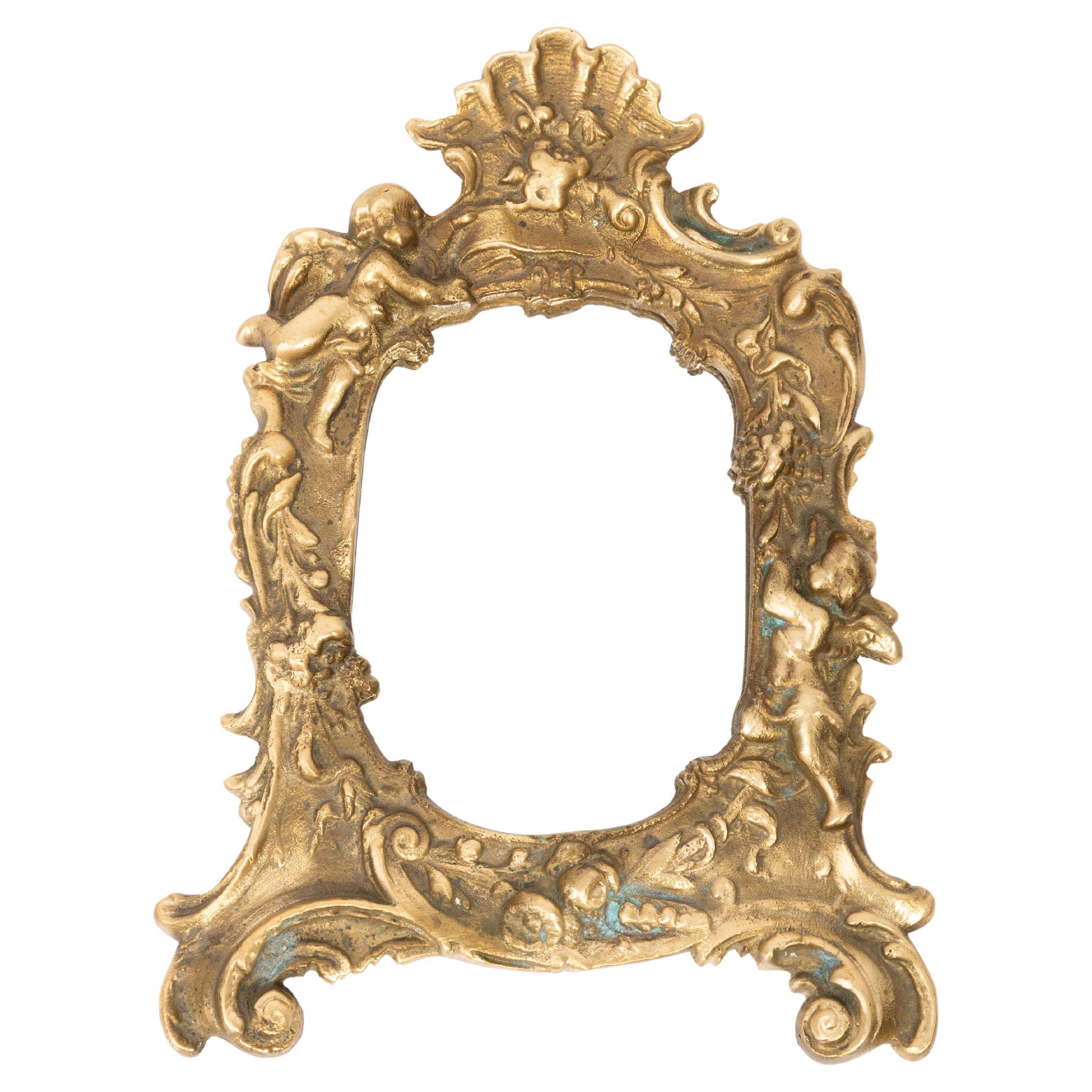 Miniature vintage gold mirror with angels, Italy, 1960s
