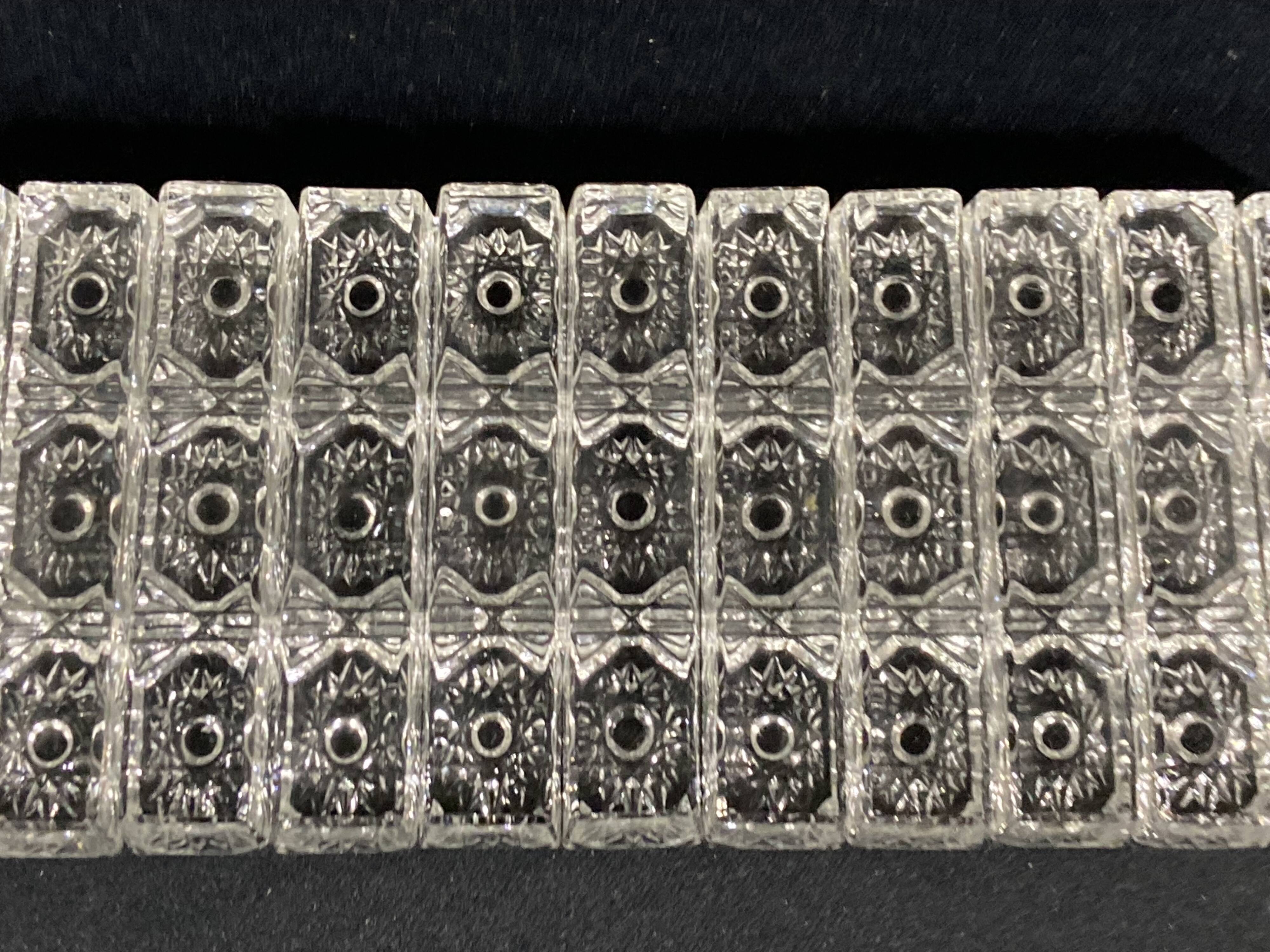 Set of 12 molded glass or crystal knife rests with diamond point decor