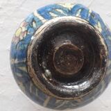 A very original antique vase with a floral design.