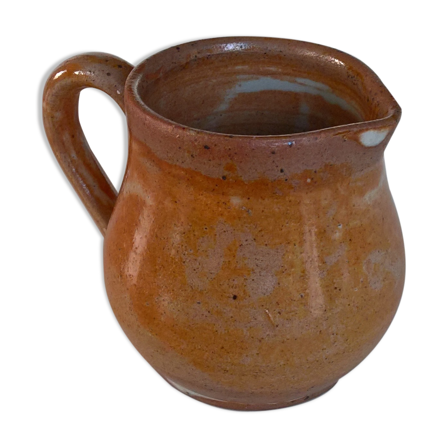 Creamy milk pot in sandstone