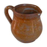 Creamy milk pot in sandstone
