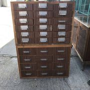 Brown wooden industrial wardrobe, multiple drawers, 1950s, workshop storage, Czech Republic.
