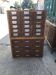 Brown wooden industrial wardrobe, multiple drawers, 1950s, workshop storage, Czech Republic.