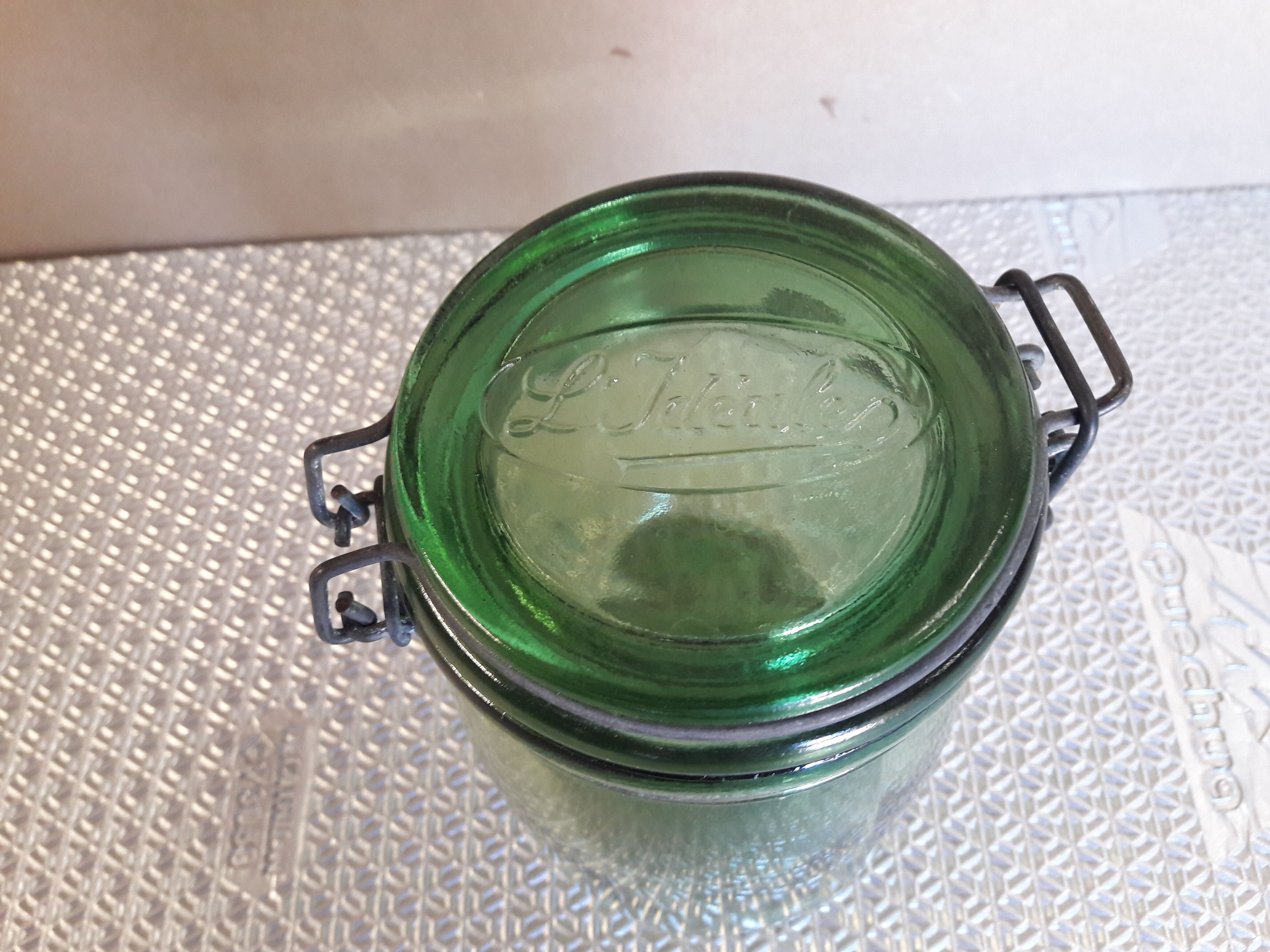 Green glass jar l l 'ideal