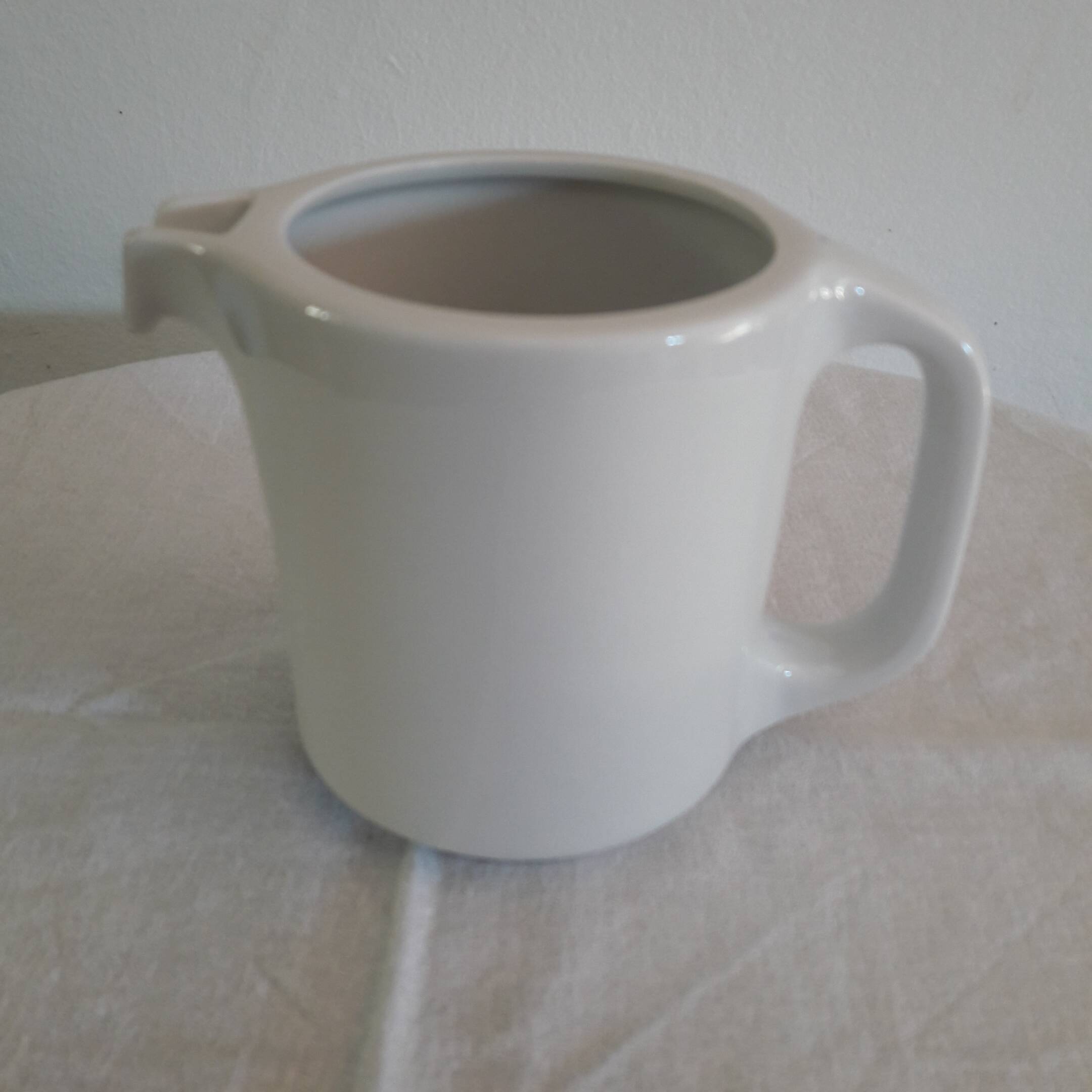 Large white porcelain milk jug
