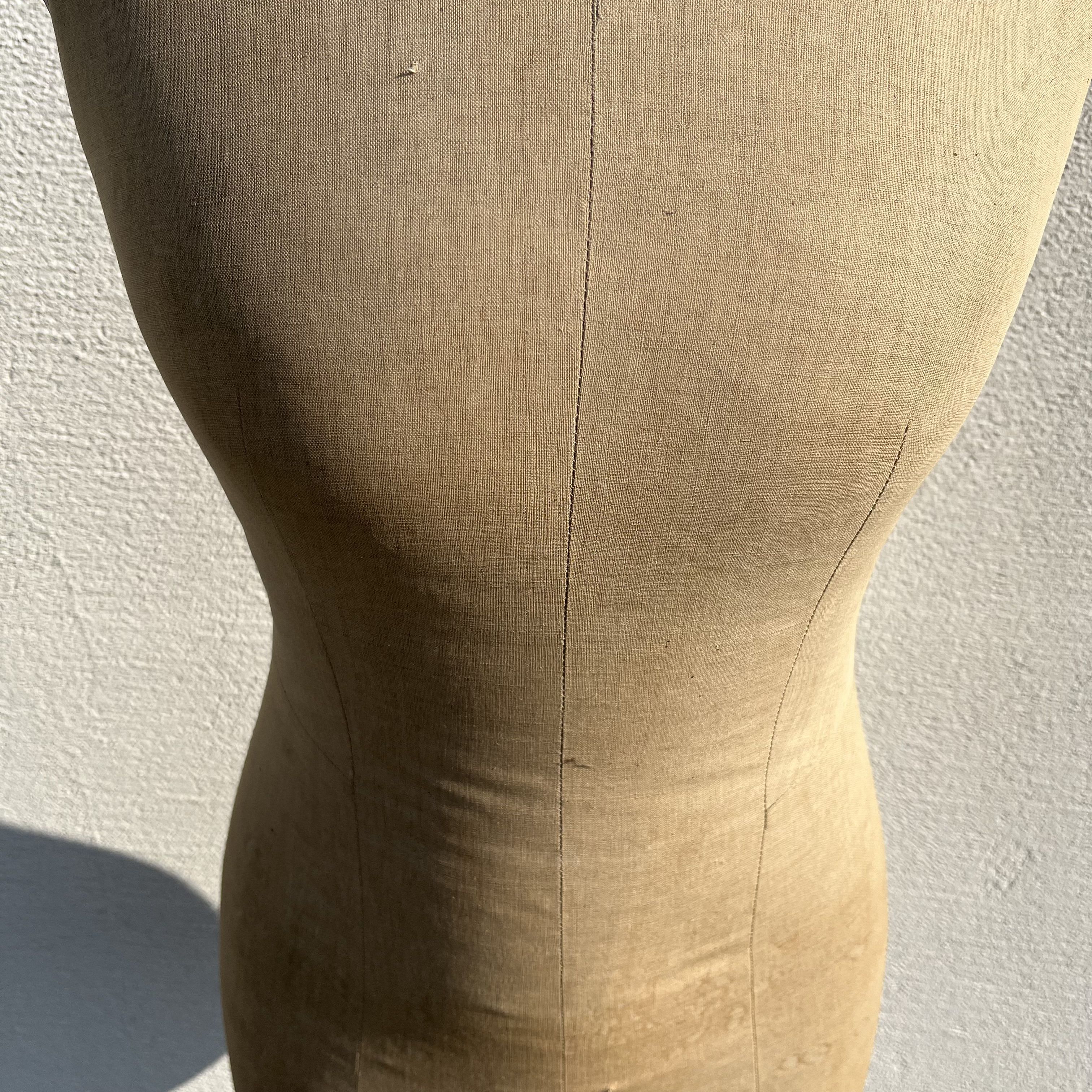 Antique mannequin in fabric and blackened wooden foot Stockman Paris Le Louvre