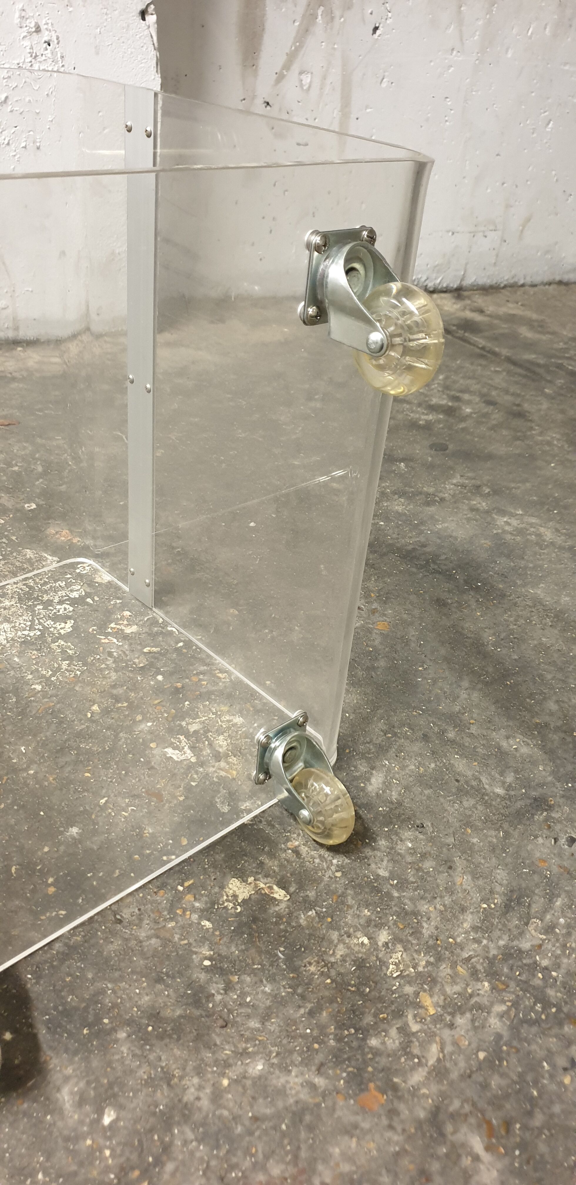 Vintage plexi coffee table with David Lange casters