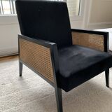 Fauteuil en velours noir et cannage