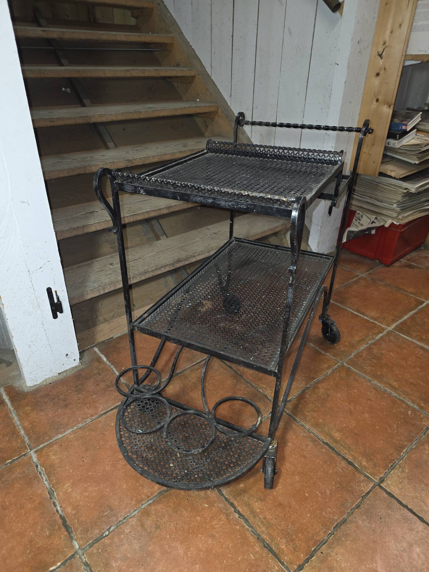 Perforated wrought iron rolling dessert trolley