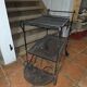 Perforated wrought iron rolling dessert trolley