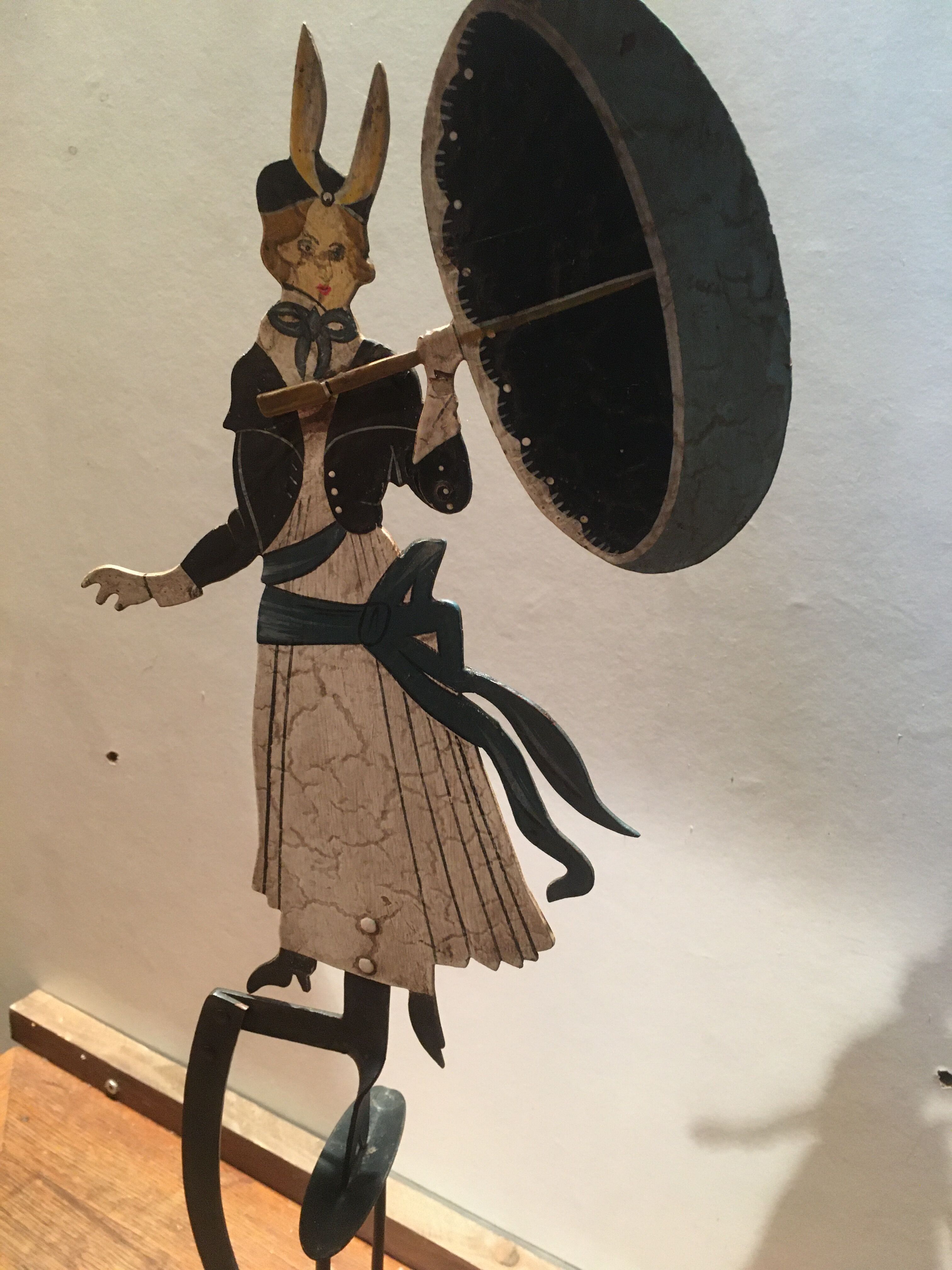 Woman with metal umbrella, pendulum
