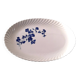 Keller and Guérin Lunéville serving dish with blue flowers on a white background.
