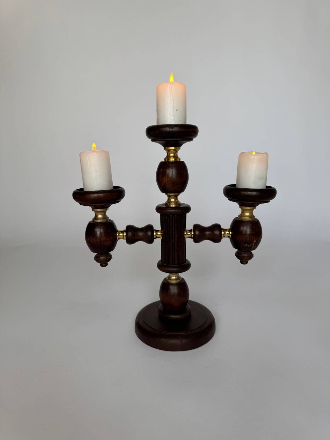 Vintage brutalist wooden candelabrum with gold hardware.